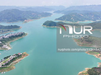 An aerial photo is showing the ecological scenery of Wanfeng Lake in Xingyi, China, on June 20, 2024. (