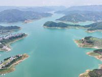 An aerial photo is showing the ecological scenery of Wanfeng Lake in Xingyi, China, on June 20, 2024. (