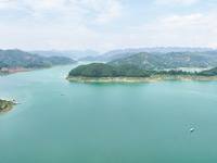 An aerial photo is showing the ecological scenery of Wanfeng Lake in Xingyi, China, on June 20, 2024. (