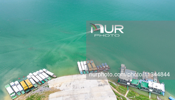 An aerial photo is showing the ecological scenery of Wanfeng Lake in Xingyi, China, on June 20, 2024. 