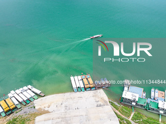 An aerial photo is showing the ecological scenery of Wanfeng Lake in Xingyi, China, on June 20, 2024. (