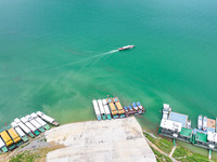 An aerial photo is showing the ecological scenery of Wanfeng Lake in Xingyi, China, on June 20, 2024. (