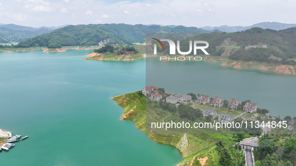 An aerial photo is showing the ecological scenery of Wanfeng Lake in Xingyi, China, on June 20, 2024. 