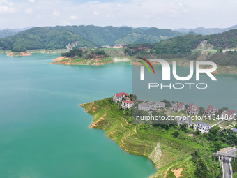 An aerial photo is showing the ecological scenery of Wanfeng Lake in Xingyi, China, on June 20, 2024. (