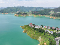 An aerial photo is showing the ecological scenery of Wanfeng Lake in Xingyi, China, on June 20, 2024. (