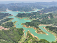 An aerial photo is showing the ecological scenery of Wanfeng Lake in Xingyi, China, on June 20, 2024. (