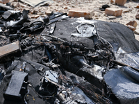 Rubble is covering the ground outside an administrative building of the State Research Control Institute of Veterinary Medicinal Products an...