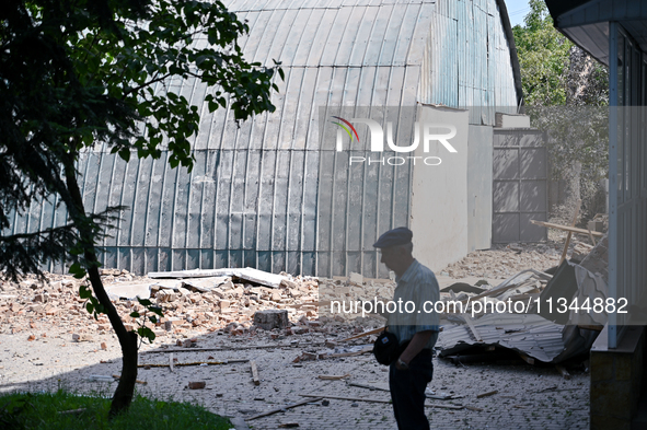 A man is standing among the rubble at the State Research Control Institute of Veterinary Medicinal Products and Feed Additives after a night...