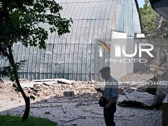 A man is standing among the rubble at the State Research Control Institute of Veterinary Medicinal Products and Feed Additives after a night...