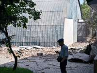 A man is standing among the rubble at the State Research Control Institute of Veterinary Medicinal Products and Feed Additives after a night...