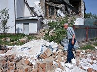 A man is standing among the rubble at the State Research Control Institute of Veterinary Medicinal Products and Feed Additives after a night...