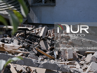 Rubble is covering the ground outside an administrative building of the State Research Control Institute of Veterinary Medicinal Products an...