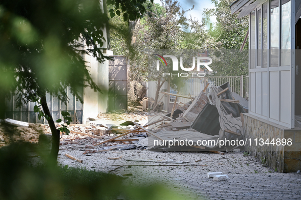 Debris is covering the ground outside an administrative building of the State Research Control Institute of Veterinary Medicinal Products an...