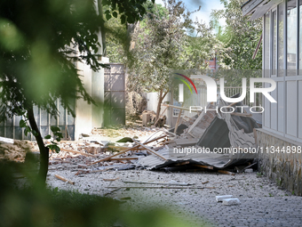 Debris is covering the ground outside an administrative building of the State Research Control Institute of Veterinary Medicinal Products an...