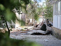 Debris is covering the ground outside an administrative building of the State Research Control Institute of Veterinary Medicinal Products an...