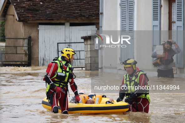 Firefighters are rescuing people after a huge storm in Narcy, France, on June 20, 2024. 