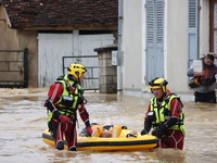 Firefighters are rescuing people after a huge storm in Narcy, France, on June 20, 2024. (