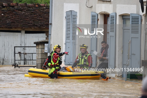 Firefighters are rescuing people after a huge storm in Narcy, France, on June 20, 2024. 