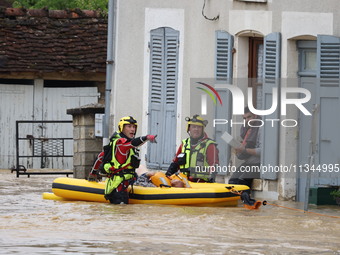 Firefighters are rescuing people after a huge storm in Narcy, France, on June 20, 2024. (