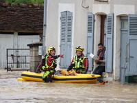 Firefighters are rescuing people after a huge storm in Narcy, France, on June 20, 2024. (