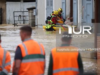 Firefighters are rescuing people after a huge storm in Narcy, France, on June 20, 2024. (