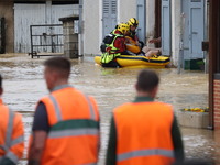 Firefighters are rescuing people after a huge storm in Narcy, France, on June 20, 2024. (