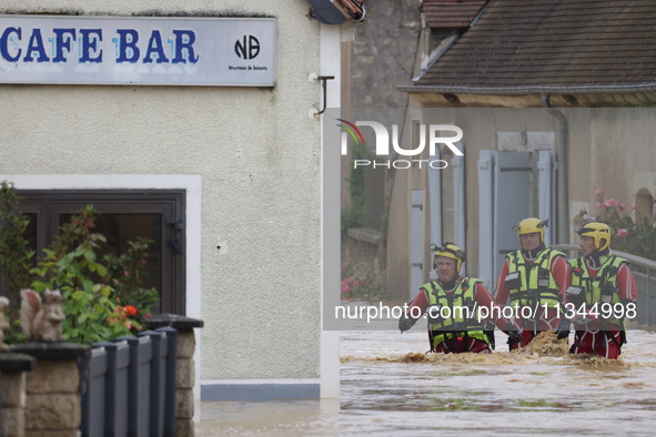 Firefighters are rescuing people after a huge storm in Narcy, France, on June 20, 2024. 