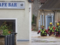 Firefighters are rescuing people after a huge storm in Narcy, France, on June 20, 2024. (