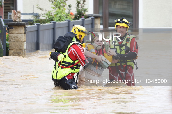 Firefighters are rescuing people after a huge storm in Narcy, France, on June 20, 2024. 