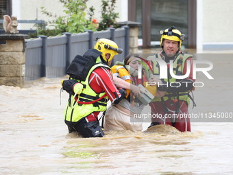 Firefighters are rescuing people after a huge storm in Narcy, France, on June 20, 2024. (