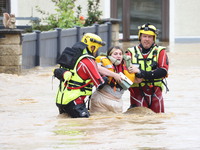 Firefighters are rescuing people after a huge storm in Narcy, France, on June 20, 2024. (