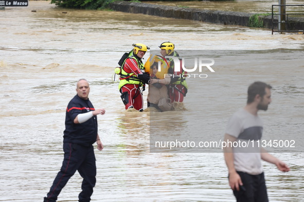 Firefighters are rescuing people after a huge storm in Narcy, France, on June 20, 2024. 