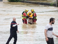 Firefighters are rescuing people after a huge storm in Narcy, France, on June 20, 2024. (