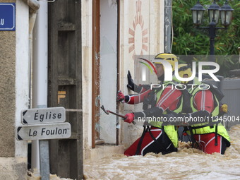 Firefighters are rescuing people after a huge storm in Narcy, France, on June 20, 2024. (