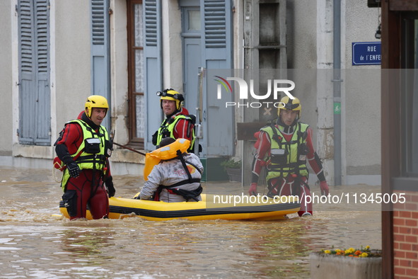 Firefighters are rescuing people after a huge storm in Narcy, France, on June 20, 2024. 