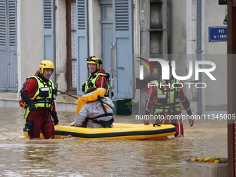 Firefighters are rescuing people after a huge storm in Narcy, France, on June 20, 2024. (