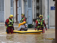 Firefighters are rescuing people after a huge storm in Narcy, France, on June 20, 2024. (