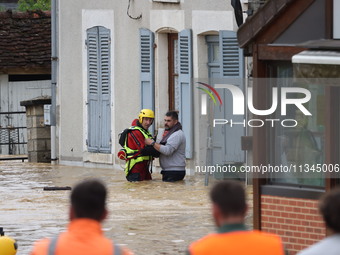 Firefighters are rescuing people after a huge storm in Narcy, France, on June 20, 2024. (