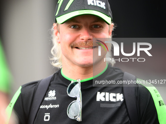 Valtteri Bottas of Stake F1 Team KICK Sauber is arriving into the paddock during Thursday media day of the Spanish GP, the 10th round of the...