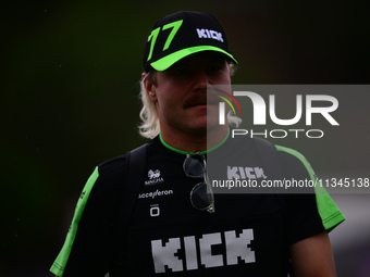 Valtteri Bottas of Stake F1 Team KICK Sauber is arriving into the paddock during Thursday media day of the Spanish GP, the 10th round of the...