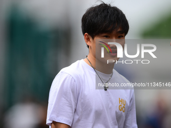 Yuki Tsunoda of Visa Cash-Up Racing Bulls is arriving into the paddock during Thursday media day of the Spanish GP, the 10th round of the Fo...