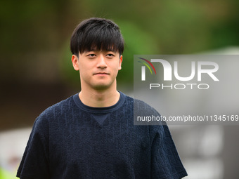 Guanyu Zhou of Stake F1 Team KICK Sauber is arriving into the paddock during Thursday media day of the Spanish GP, the 10th round of the For...