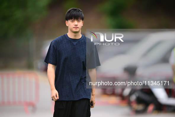 Guanyu Zhou of Stake F1 Team KICK Sauber is arriving into the paddock during Thursday media day of the Spanish GP, the 10th round of the For...