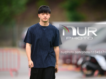 Guanyu Zhou of Stake F1 Team KICK Sauber is arriving into the paddock during Thursday media day of the Spanish GP, the 10th round of the For...