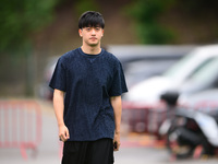 Guanyu Zhou of Stake F1 Team KICK Sauber is arriving into the paddock during Thursday media day of the Spanish GP, the 10th round of the For...