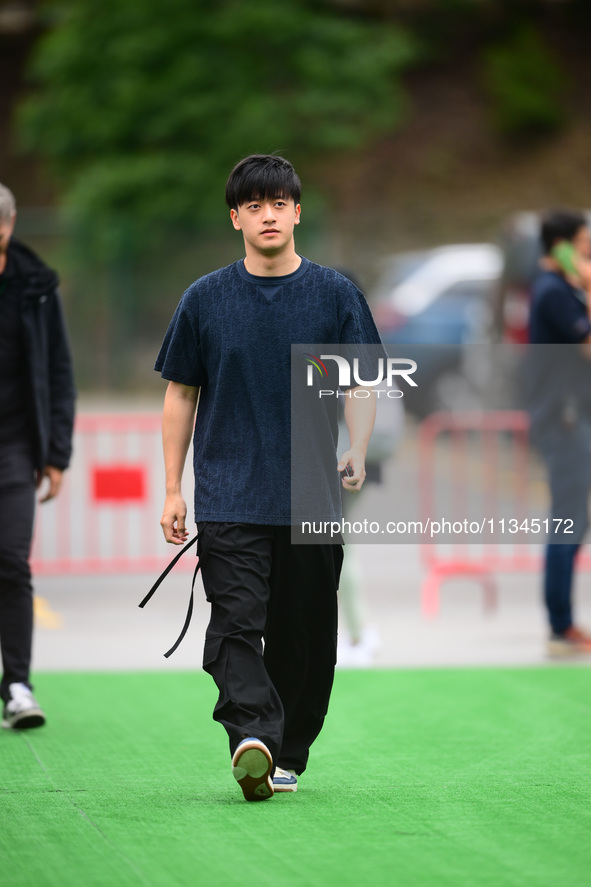 Guanyu Zhou of Stake F1 Team KICK Sauber is arriving into the paddock during Thursday media day of the Spanish GP, the 10th round of the For...