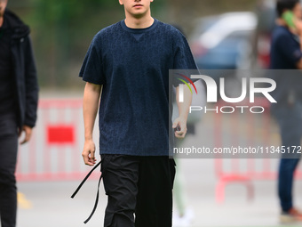 Guanyu Zhou of Stake F1 Team KICK Sauber is arriving into the paddock during Thursday media day of the Spanish GP, the 10th round of the For...