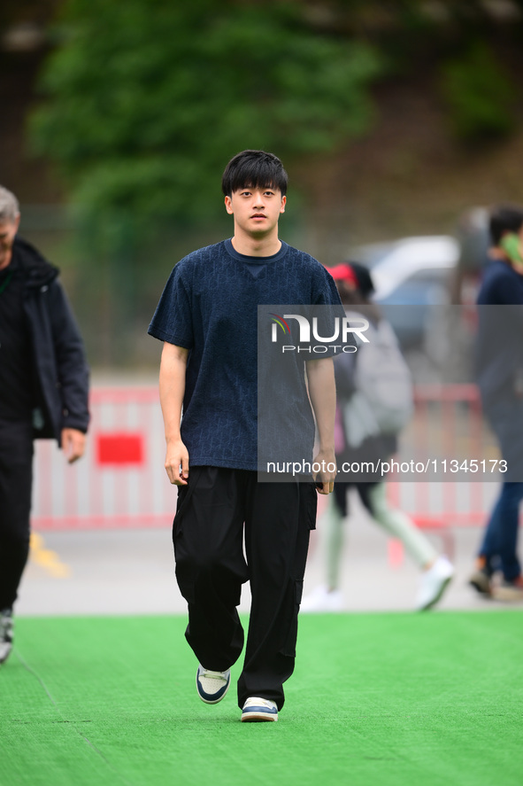 Guanyu Zhou of Stake F1 Team KICK Sauber is arriving into the paddock during Thursday media day of the Spanish GP, the 10th round of the For...