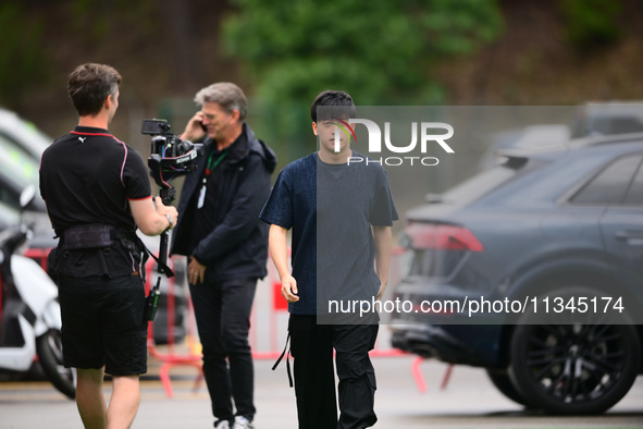 Guanyu Zhou of Stake F1 Team KICK Sauber is arriving into the paddock during Thursday media day of the Spanish GP, the 10th round of the For...