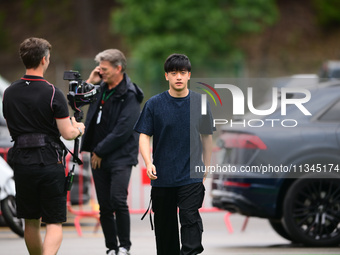 Guanyu Zhou of Stake F1 Team KICK Sauber is arriving into the paddock during Thursday media day of the Spanish GP, the 10th round of the For...